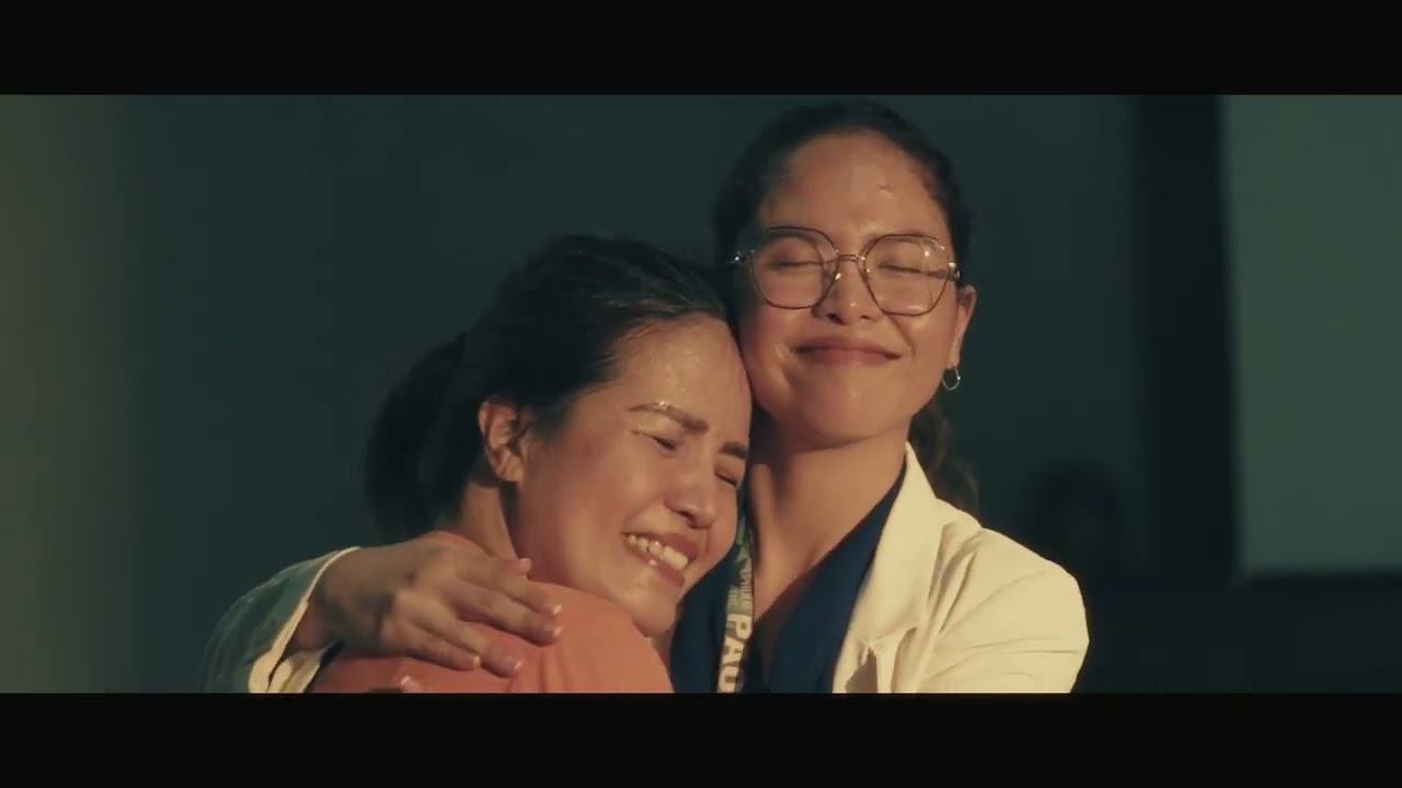 Two women embracing in a frame from PAO Film 2025